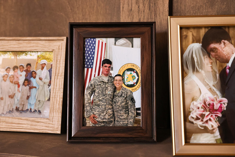 Framed photos of Sam Brown with family and in uniform