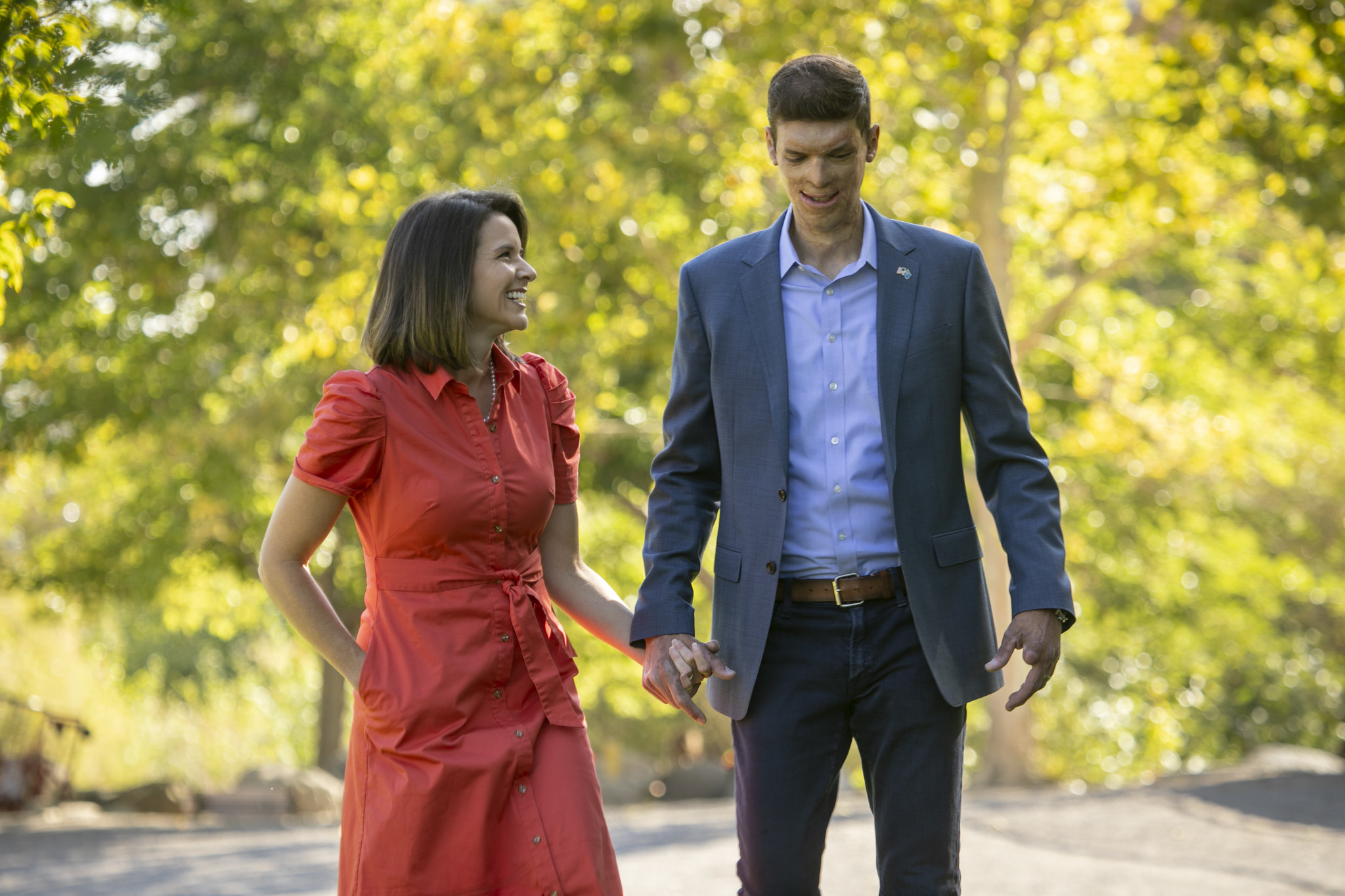 Sam and Amy Brown walking together, holding hands